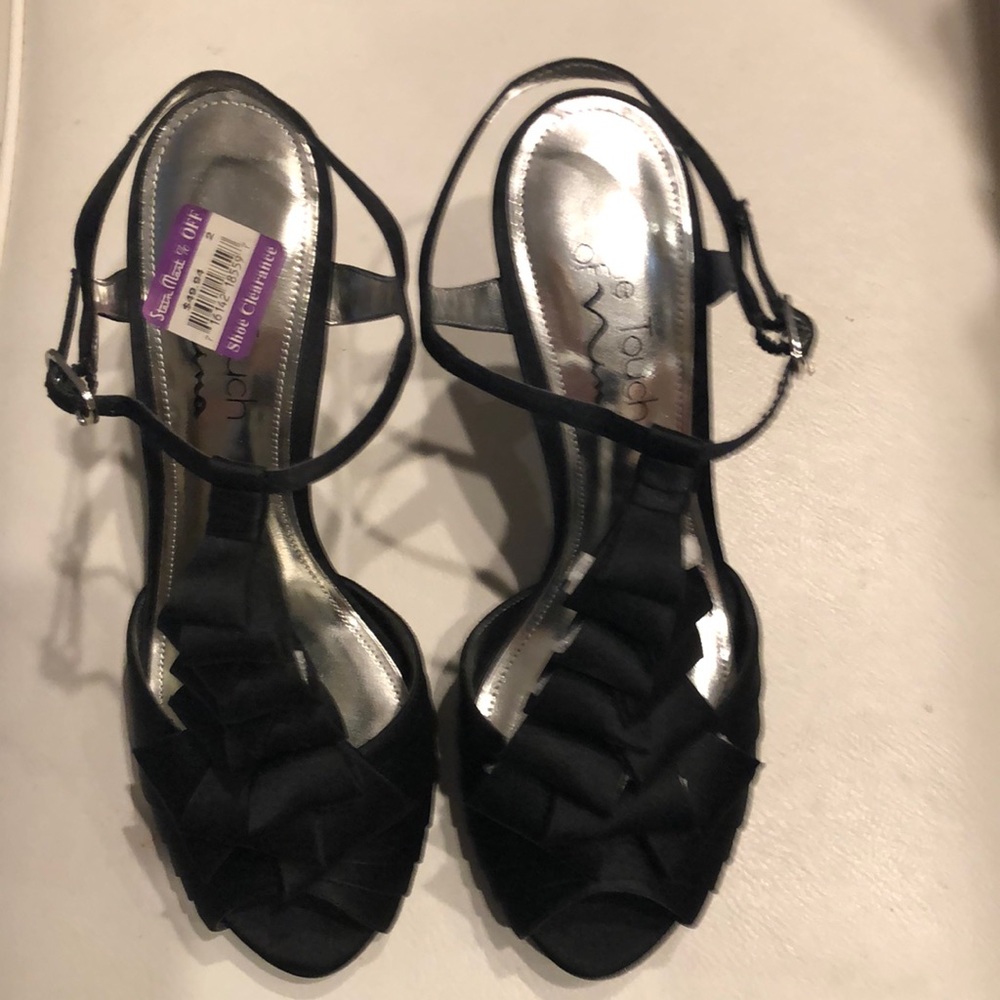 Black heels, never worn, size 6-1/2.